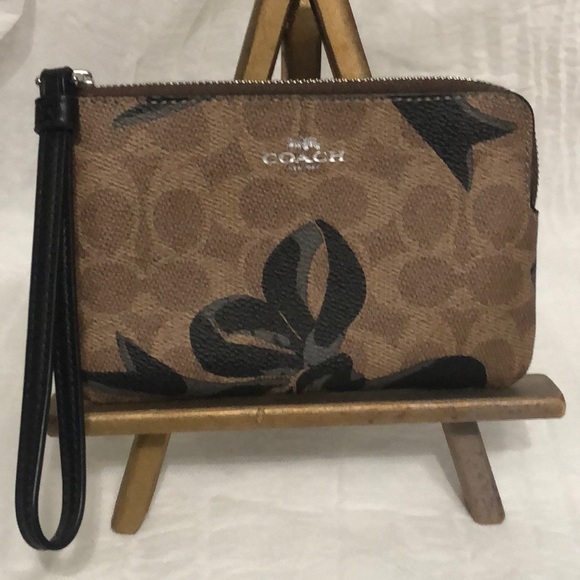 Coach Handbags - Coach Brown Signature Floral Wristlet with Black Trim